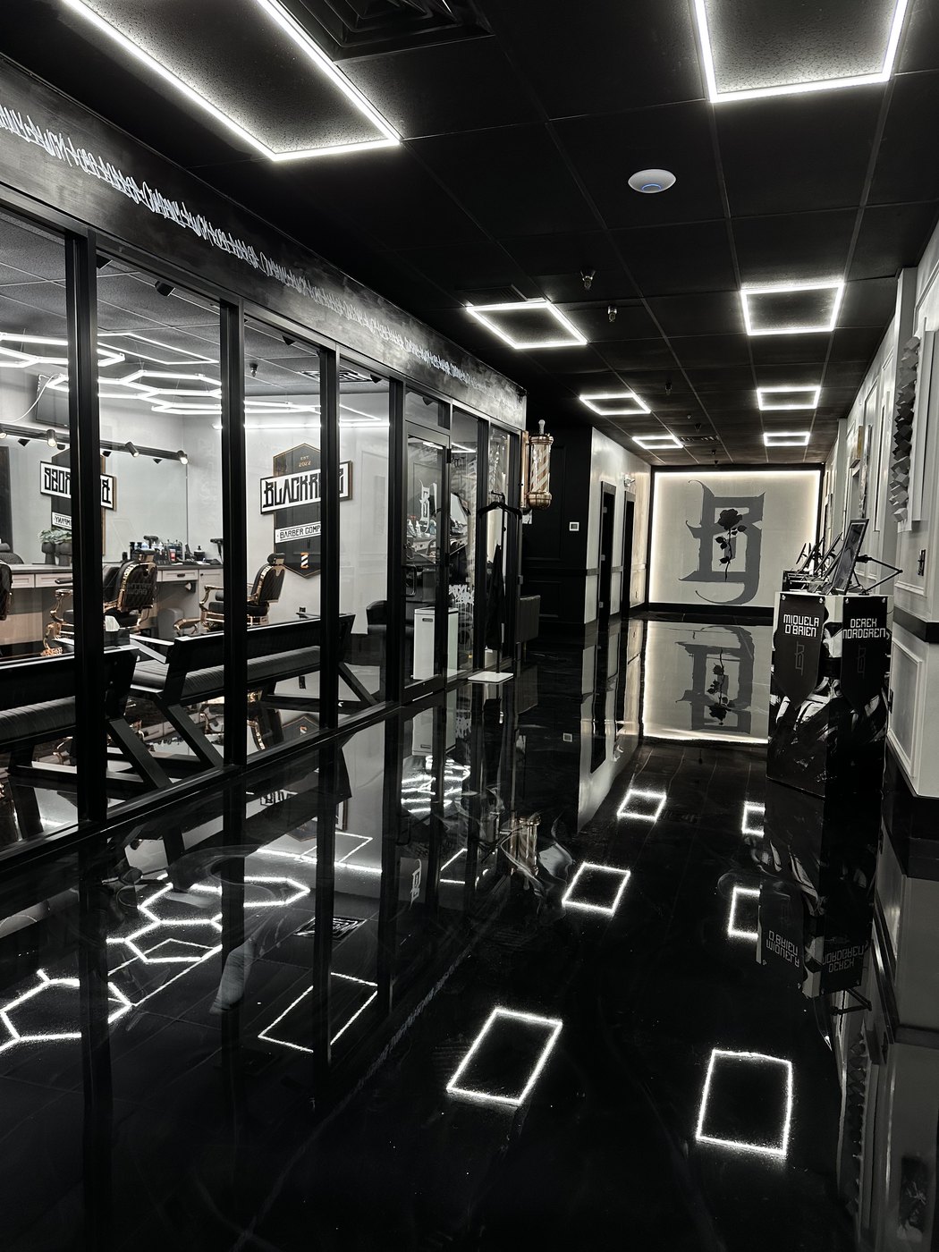The barbershop through the glass, from the hallway