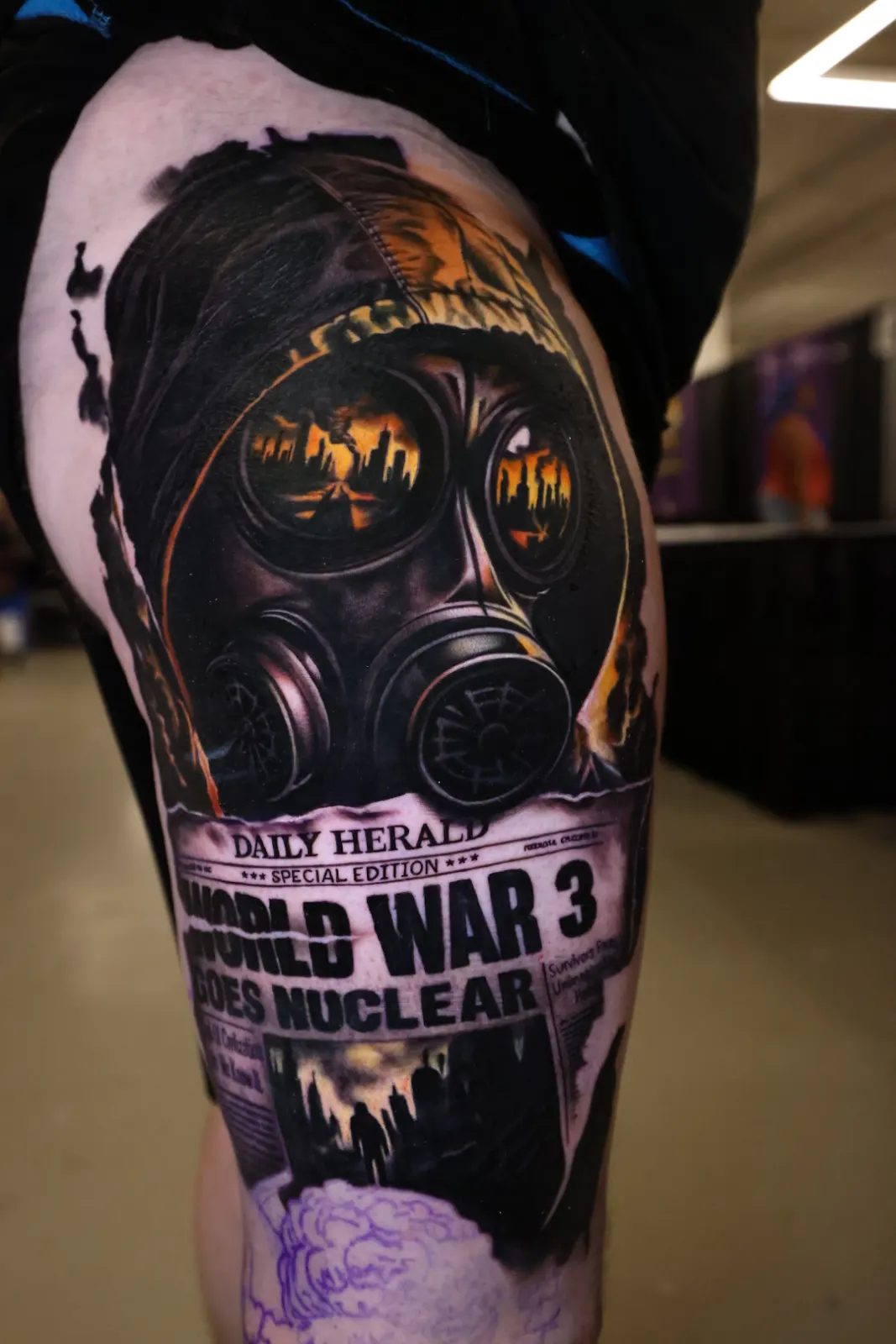 Gas mask over a World War III front page