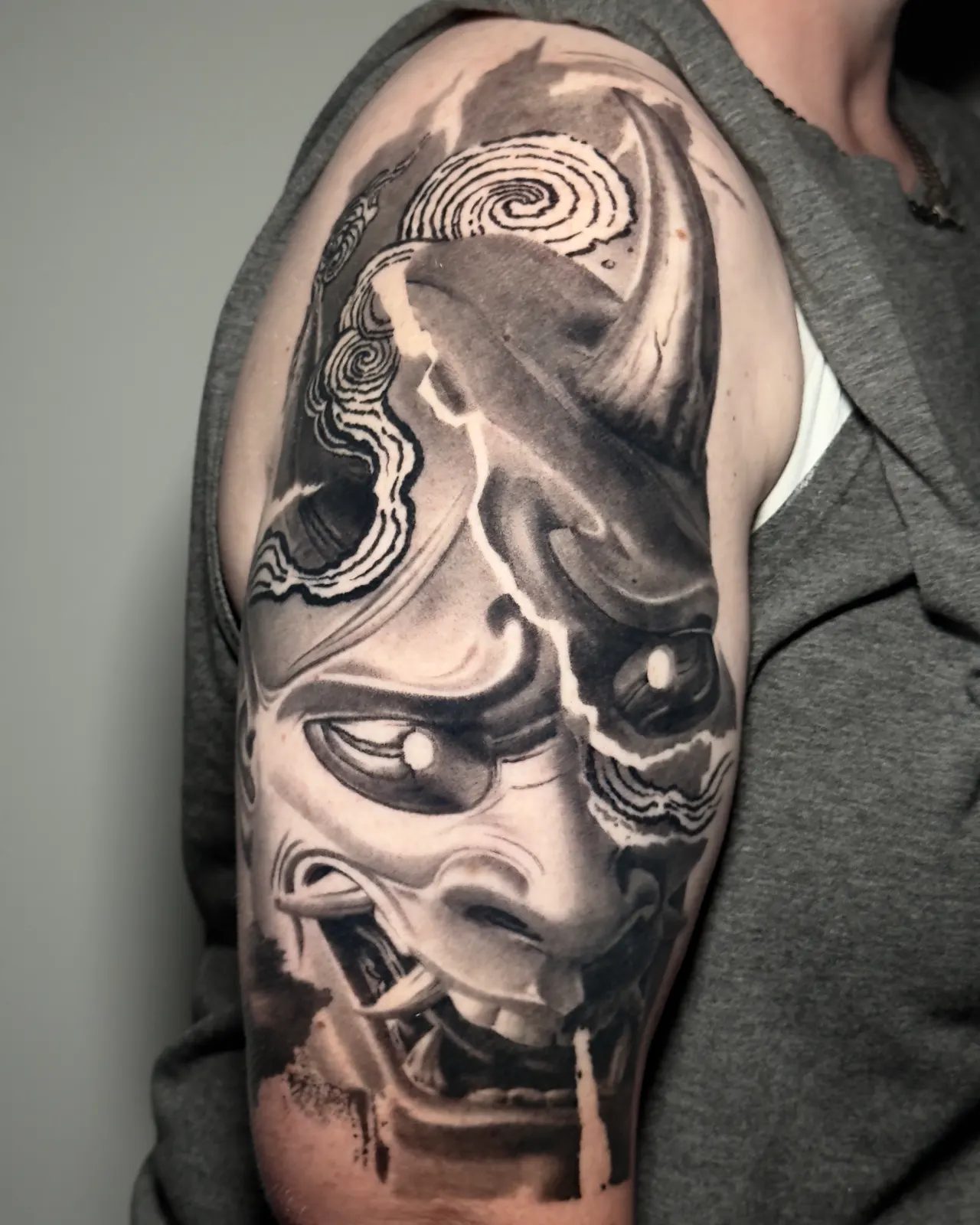 Hannya mask in smoke, black and grey