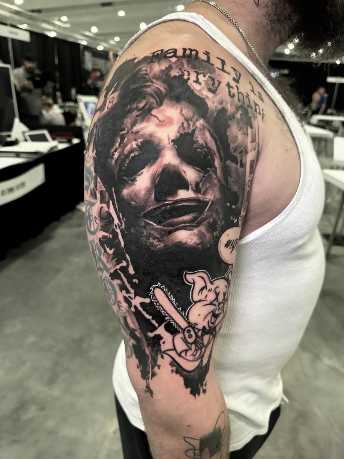 Anguished portrait with torn edges, upper arm