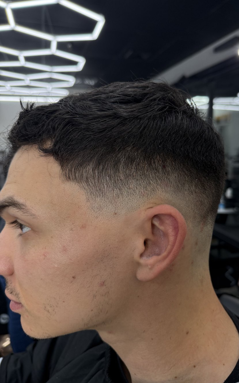 Short textured crop with a mid skin fade
