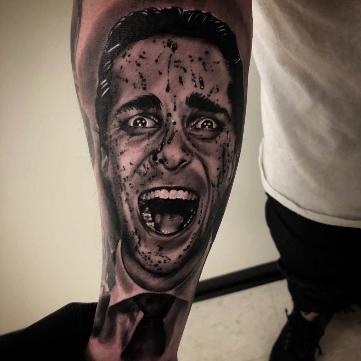 Screaming suited portrait in black and grey, lower leg