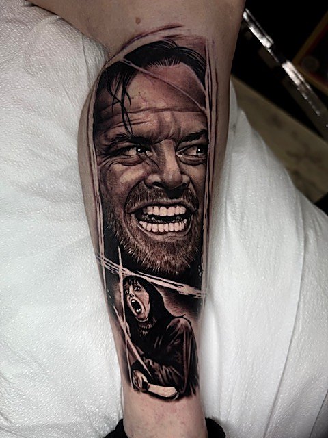Grinning portrait in black and grey, inner arm