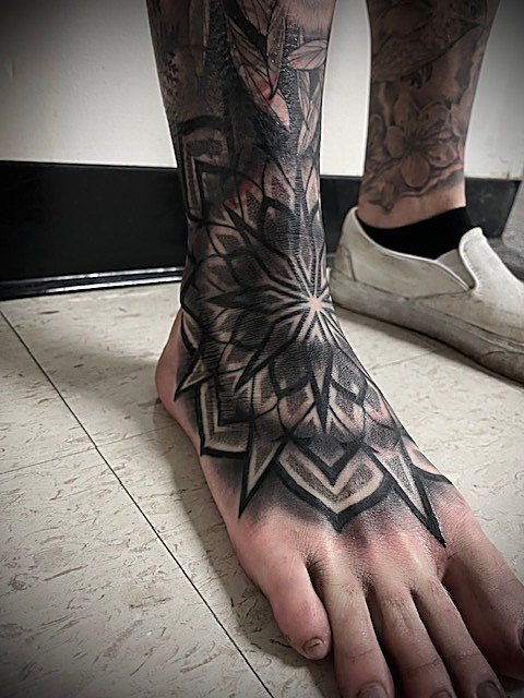 Geometric mandala across the top of the foot