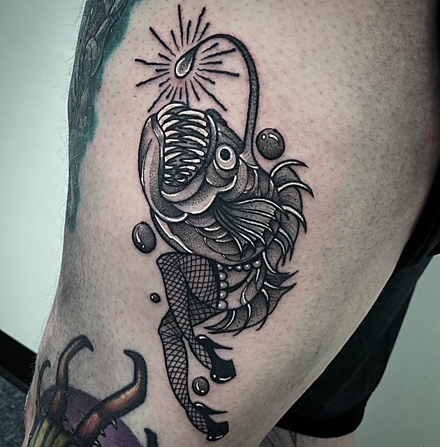 Anglerfish in fine line work, thigh