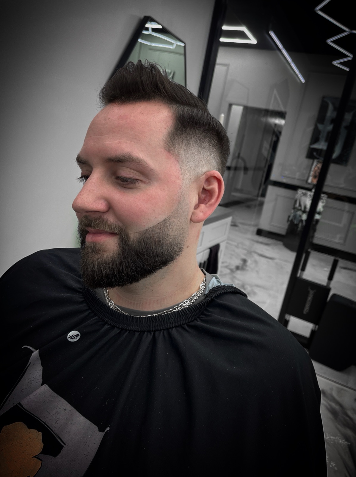 Pompadour fade with full beard sculpting