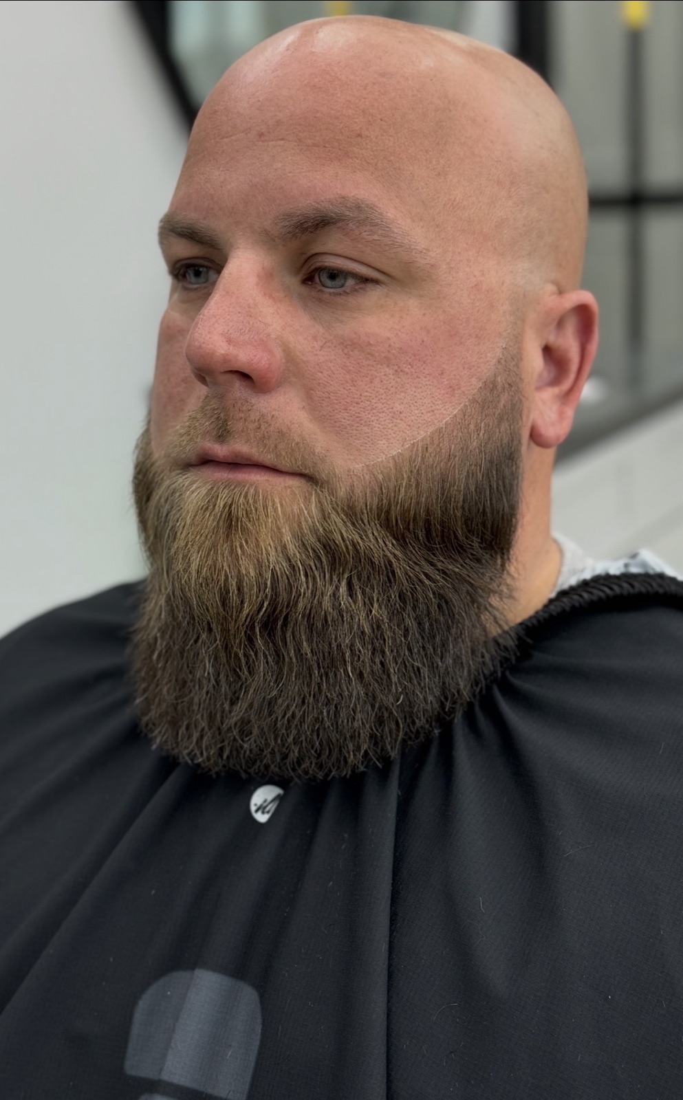 Full beard sculpt with a razor cheek line