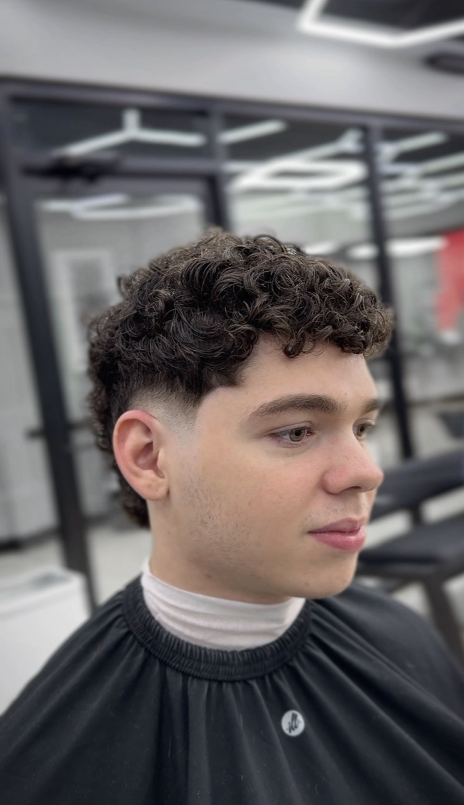 Curly top with a burst fade