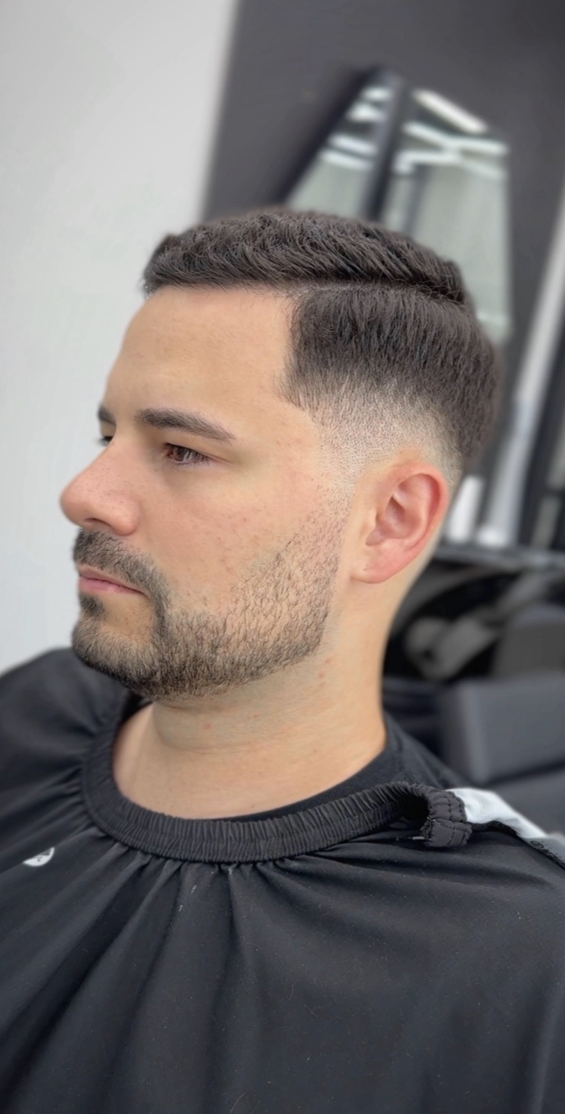 Classic side part with a blended taper