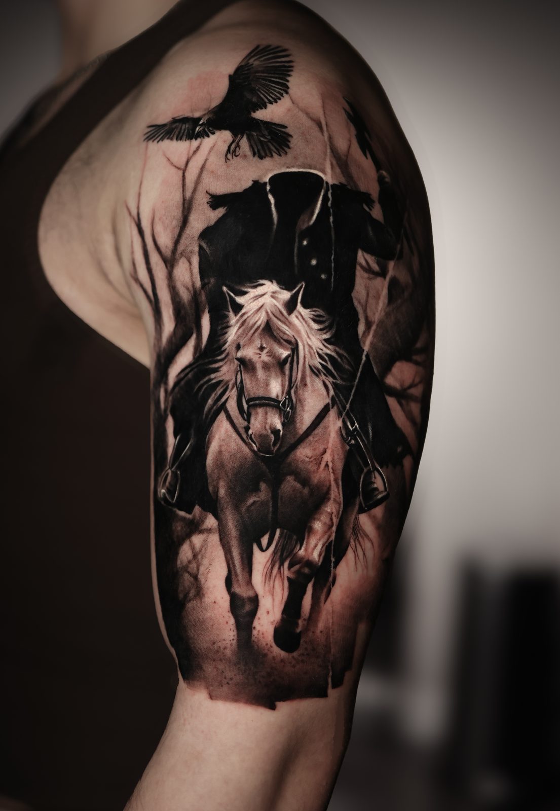 Horse and rider beneath a crow, black and grey half sleeve
