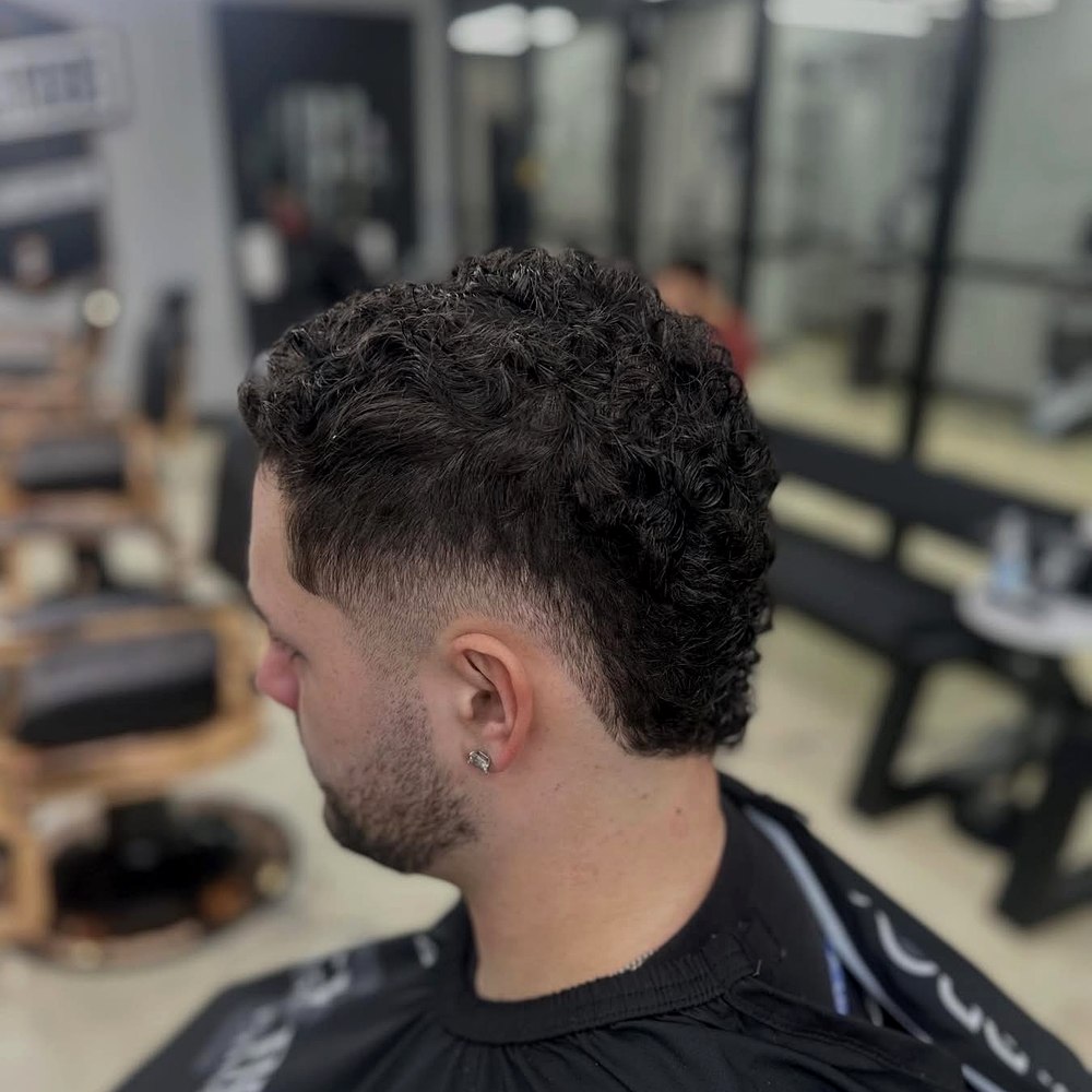 Curly top with taper fade