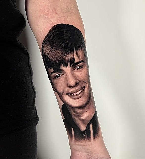 Portrait of a young man on the forearm