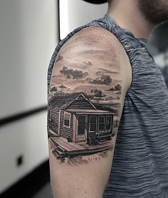 Farmhouse landscape across the shoulder
