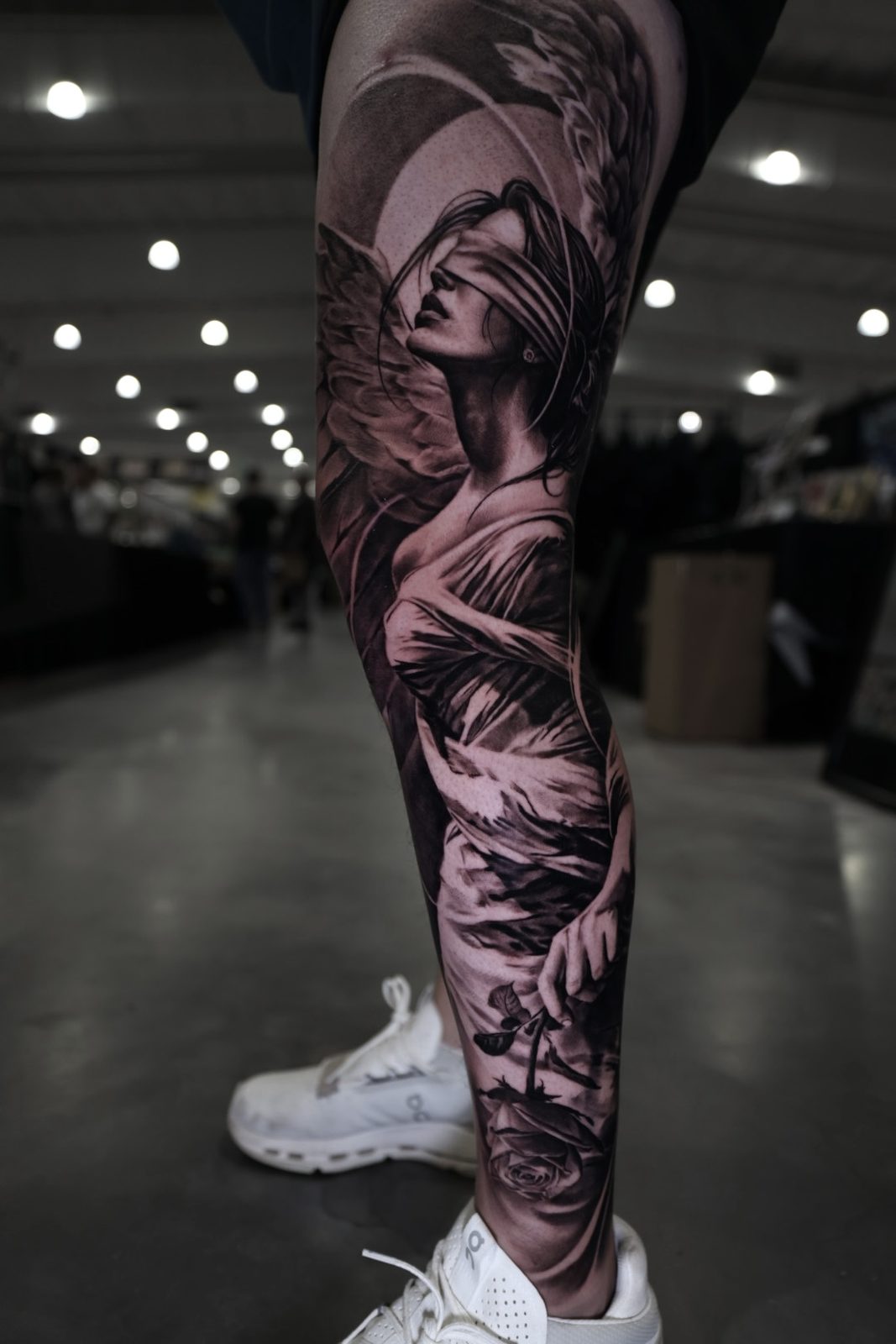 Draped figure running the full leg