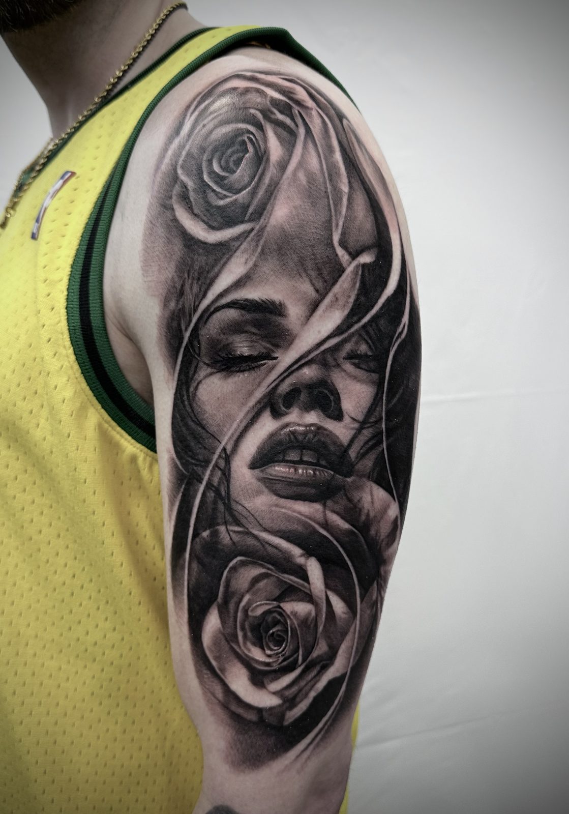 Portrait framed by roses, upper arm