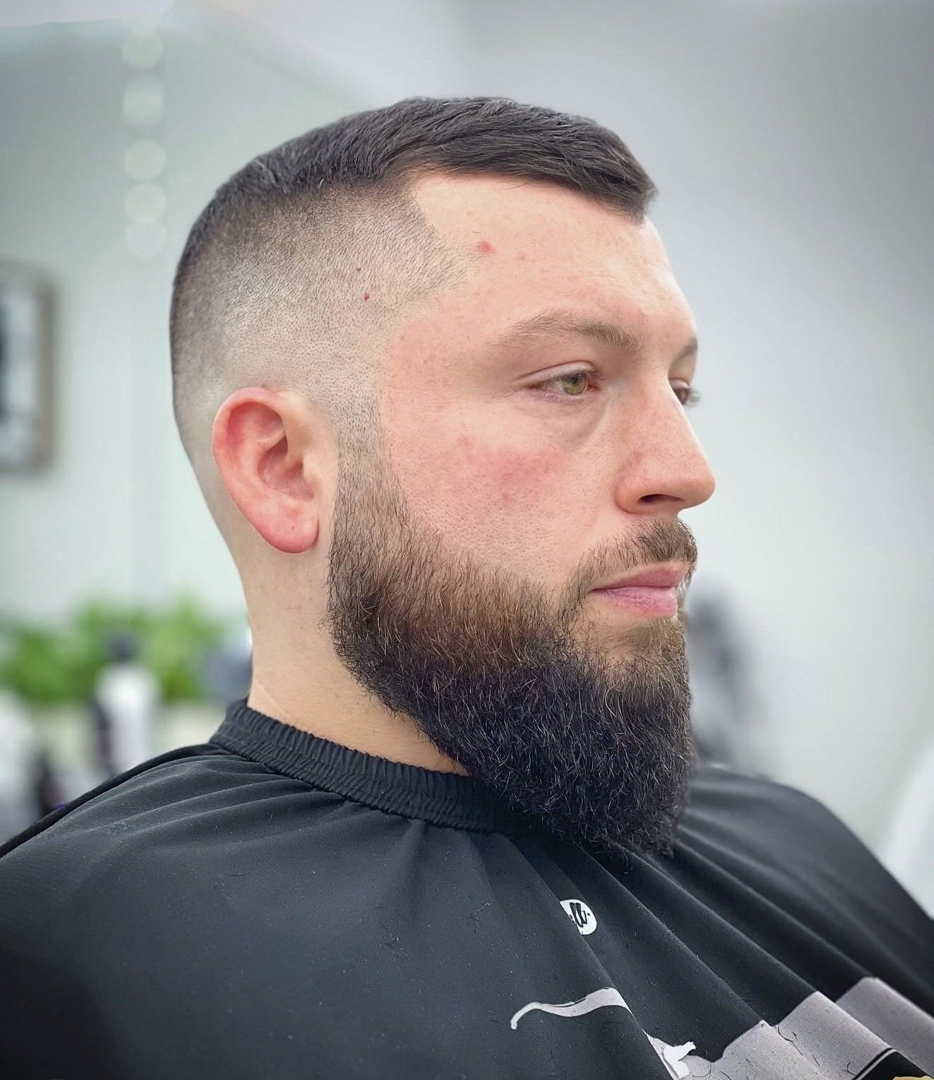 Skin fade with a dense beard